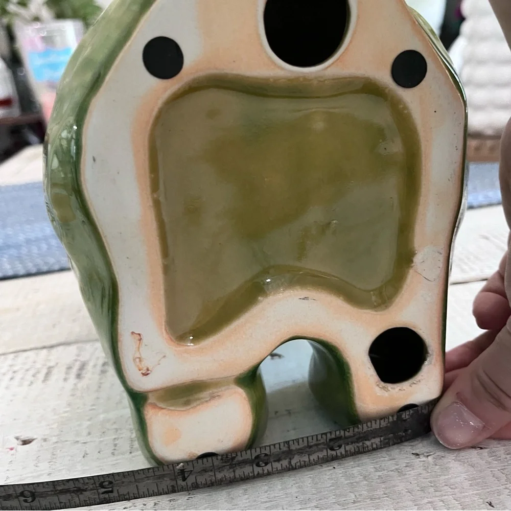 Elephant ceramic- Green Glaze Sitting with Floral Design 10 1/2” euc